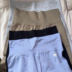 Bundle of work out shorts. Grey, Lavender, Tan, Black all size medium
